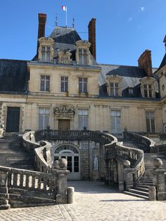 an old building with stairs leading up to it