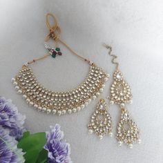 Traditional Kundan Necklace Set / White Jewelry Set Size: Free Color: White Plating: Gold Finish Stone: Kundan Packing: Set Includes Matching Earrings and Maang Tikka As per Etsy guidelines as of July 01, 2022, GST/HST needs to be included in Pricing for customers in Canada, hence price for Canadian customers includes GST/HST. Provincial taxes apply separately by Etsy wherever applicable in Canada. We offer free shipping. We keep fair pricing considering inflated cost of shipping within Canada and to US. Canadian Prices includes HST/GST. Please consider this while evaluating pricing and reviewing the product. We do pack all  Orders very well for shipping but Sometimes Gemstone or mirror can be detached during hard shipping, It can be easily reattached with super glue.  Please be careful wh White Jewelry Set, White Stone Jewelry, Bollywood Bridal, Kundan Necklace Set, Maang Tikka, Kundan Necklace, Jewelry Indian, Kundan Necklaces, White Jewelry