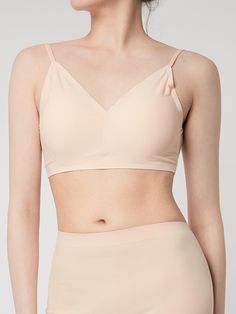 Composition : 85% nylon, 15% spandex, Pad shall :100% cotton, Pad inside: urethane foamColor : beige, white, blackCountry of Origin : China Beige Stretch Sports Bra With Built-in Bra, Low-cut Crop Top With Built-in Bra, Stretch Low-cut Bra Friendly Crop Top, Solid Color Low-cut Sports Bra With Removable Pads, Elegant Seamless Stretch Crop Top, Elegant Stretch Seamless Crop Top, Fitted Low-cut Sports Bra, Solid Sports Bra With Removable Pads And Minimal Stretch, Sports Bra With Removable Pads And Minimal Stretch