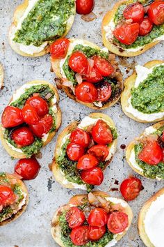 small sandwiches with tomatoes and pesto on them