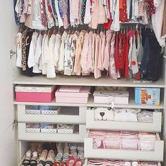 a closet filled with lots of baby clothes and shoes on top of it's shelves