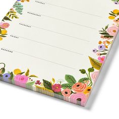 a notepad with flowers and leaves on it