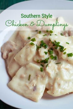 a white plate topped with chicken and dumplings covered in gravy