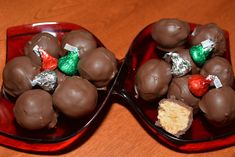 two red bowls filled with chocolate covered candies