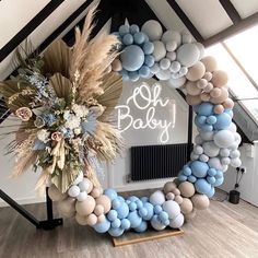 a baby shower decoration made out of balloons