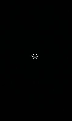 a black background with a smiley face in the dark