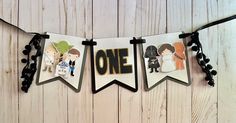 a banner with star wars characters hanging from it's sides on a wooden wall