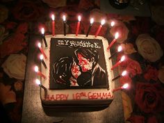 a birthday cake decorated with candles and an image of a man