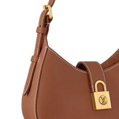 LOUIS VUITTON® - Low Key Shoulder Bag - Cognac Timeless Cognac Bag With Branded Hardware, Brown Bag With Lock For Evening, Luxury Versatile Brown Shoulder Bag, Luxury Brown Bag With Leather Lining, Brown Bags With Lock For Everyday Luxury, Luxury Cognac Bags With Branded Hardware, Luxury Light Brown Shoulder Bag With Leather Handles, Chic Brown Shoulder Bag With Lock, Leather Shoulder Bag With Turn-lock For Everyday Luxury