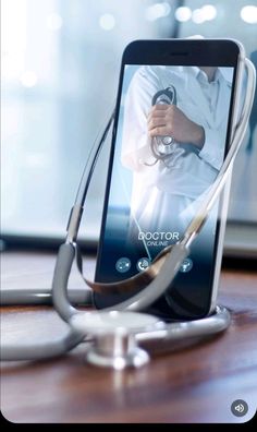 a doctor's stethoscope is connected to a smart phone on a table