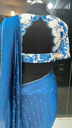 Product Descriptions : Pure jute blue embroidery designer saree with heavy floral embroidery worked pallu is paired up with white semi-tusser blouse having scalloped hand works for neck, back & sleeves as shown. View this post on Instagram A post shared by Handcrafted Sarees by Shobana Nithin (@threadslabel_india) Blouses For Sarees Ideas, Blouse Back Neck Designs With Tassels, Semi Sleeves Blouse Design, I Neck Blouse Design, Neck Patterns For Blouses, Modern Blouse Designs Back Neck, Modern Blouse Designs For Fancy Saree, Lakhnavi Blouse Design, Back Neck Patterns For Blouses