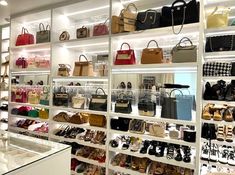 a room filled with lots of different types of purses and handbags on shelves