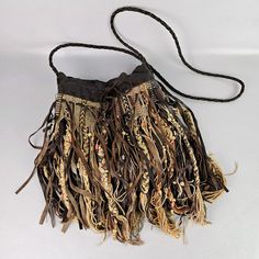 a small purse with fringes on it