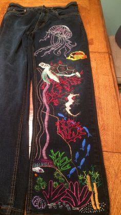 Under The Sea Inspired Outfits, Under The Sea Themed Outfit, Embroidered Sea Creatures, Fabric Paint Jeans, Embroidered Jeans Aesthetic, Y2k Embroidered Jeans, Embroidered Pants Diy, Embroidery Pants Ideas, Hand Embroidered Jeans