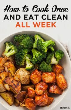 a white bowl filled with broccoli and potatoes