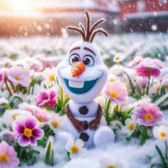 a snowman is sitting in the middle of flowers