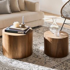 two wooden tables sitting on top of a rug