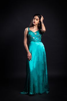 A true showstopper, this gilded foliage gown is crafted with luxurious fabrics in a beautiful emerald green hue. The fabric blend of viscose georgette and cupro satin is adorned with golden sequin embroidery, making it the perfect choice for your upcoming parties and festivities. Sleek and sophisticated, this is sure to be an absolute head-turner!Details Neckline: Sweetheart Material: Cupro satin and viscose georgette Lining: Cotton-polyester Made in India What makes this outfit sustainable?Cupro satin, which is used to make this outfit, is created from cotton linter waste. It serves as a sustainable alternative to polyester. Viscose is made from renewable plants, is environmentally friendly, and is a sustainable alternative to polyester. Sequin Embroidery, Just Peachy, Sequins Embroidery, Beauty Essentials, Active Wear Tops, Luxury Fabrics, Emerald Green, Denim Dress