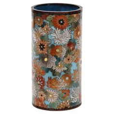 a vase with flowers painted on it