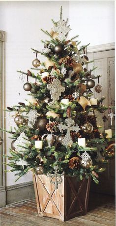 a decorated christmas tree in a wooden crate