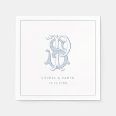 the monogramed initials on this wedding napkin are shown in light blue and white