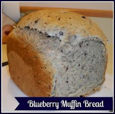 a loaf of blueberry muffin bread sitting on top of a white plate