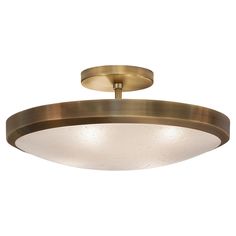 a large brass ceiling light with frosted glass shades on the bottom and an oval shape