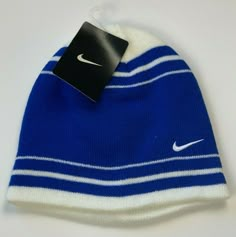 Authentication:  100% Authentic Nike merchandise Hat Description:  Royal blue and white beanie winter hat no cuff Hat Design:  Horizontal royal blue and white stripes with Nike logo embroidered in white on the front Hat Material:  100% Acrylic - Warm and comfortable - Machine washable Hat Size:   Youth boys 8/20 Status:  Brand NEW! Tags:  Official Nike tag still attached! Shipping:  FREE Via USPS!  BUY WITH CONFIDENCE – 100% POSITIVE FEEDBACK!  Check out my eBay store at stores.ebay.com/officerb Nike Winter Beanie Hat, Classic Blue Sports Hat, Nike Casual Winter Hats, Casual Nike Winter Hat, Classic Blue Winter Hat, Blue Outdoor Beanie Hat, Outdoor Blue Beanie Hat, Warm Blue Cap, White Winter Hat