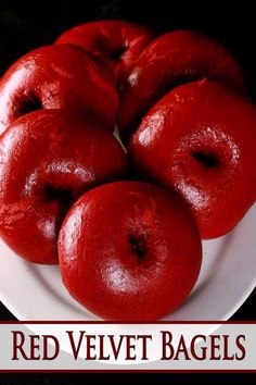 red velvet bagels on a white plate with the words, red velvet bagels