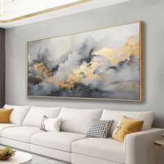 a living room filled with white couches and a painting on the wall above them