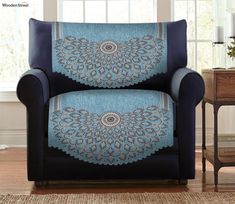 a blue chair with an intricate design on it