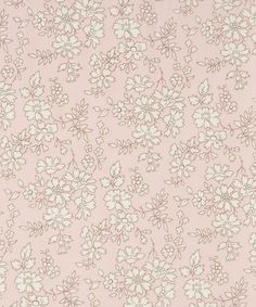 a pink and white flowered background with lots of small flowers on the bottom half of it