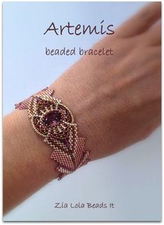 the bracelet is beaded and has an owl on it