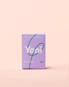 a box of yon condoms sitting on top of a pink surface with the word yon printed on it