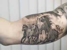 a man's arm with a horse tattoo on it and three horses running behind him