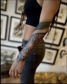 a woman with a tattoo on her arm