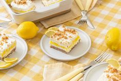 there are two slices of lemon cake on the plates