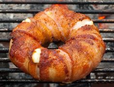 bacon wrapped pretzels cooking on an outdoor grill