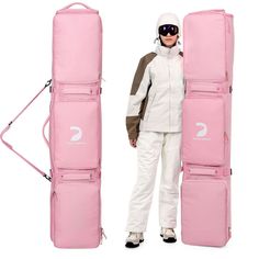 a woman standing next to a pink snowboard bag and wearing skis with the number 2 on it