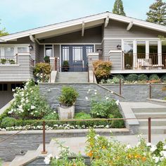 a house with landscaping and steps leading to the front door is shown in this artist's rendering