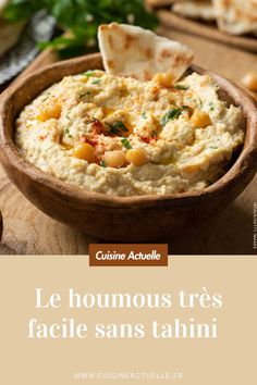 hummus with horseradish in a wooden bowl