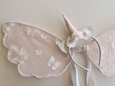 Free shipping  Welcome to our magical world! Our handmade unicorn wings are crafted with precision and care in beautiful New Zealand. We use the finest flower lace and lace trim to bring you whimsical and delicate designs that will transport you to a world of enchantment. And the best part? We offer FREE shipping straight from New Zealand! You'll receive your wings within 2-4 weeks of ordering (Worldwide) 1-2 weeks to Australia. Or express option in 1-2 weeks (worldwide) one week to Australia, 1 Unicorn Outfit Kids, Party Wings, Unicorn Wings, Unicorn Outfit, Unicorn Halloween, Unicorn Dress, Unicorn Headband, Girls Costumes, Clear Glue