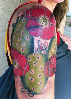 a woman with a tattoo on her arm has a cactus and flowers in the shape of a heart