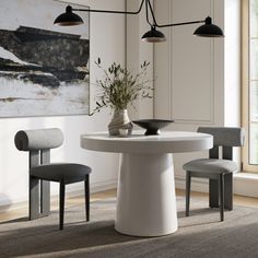 a white table and chairs in a room