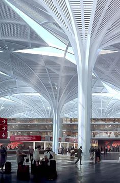 an airport terminal with people walking around and luggage bags on the ground in front of them