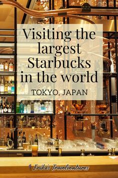 a bar with lots of bottles and glasses on the counter in front of it is a quote about visiting the largest starbucks starbuckss in the world tokyo japan