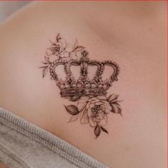 a woman with a crown tattoo on her back