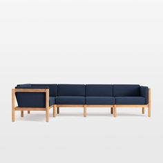 a blue couch sitting on top of a wooden frame