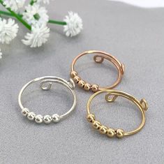 Handmade itemThis listing is for ONE ring.Beads: 3mm Gold Filed Beads ,sterling silver beads.Material: sterling silver Gold Thumb Rings, Wire Rose, Ring Spinning, Sterling Silver Thumb Rings, Thumb Rings Silver, Pool Shower, Bead Wire, Spinning Ring, Ziplock Bag