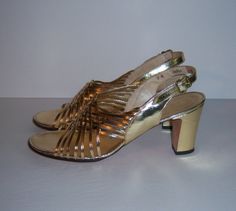 "Vintage Amano gold leather high heeled evening shoes or sandals. Excellent pre-owned condition. No holes, stains, scratches, etc. Comes with original box. Women's size 8 NARROW. Made in the U.S.A. Heel height-3\". Glam!" Gold Sandals With 4-inch Heel And Closed Toe, Gold Closed Toe Sandals For Formal Occasions, Gold Open Heel Sandals For Galas, Gold High Heel Sandals For Formal Occasions, Gold High Heel Sandals For Galas, Gold Sandals With Padded Heel For Galas, Fitted Gold Sandals With Heel Strap, Gold Ankle Strap Sandals For Galas, Metallic Round Toe Sandals For Formal Occasions